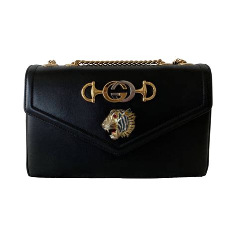 gucci tiger head color|Gucci rajah handbags meaning.